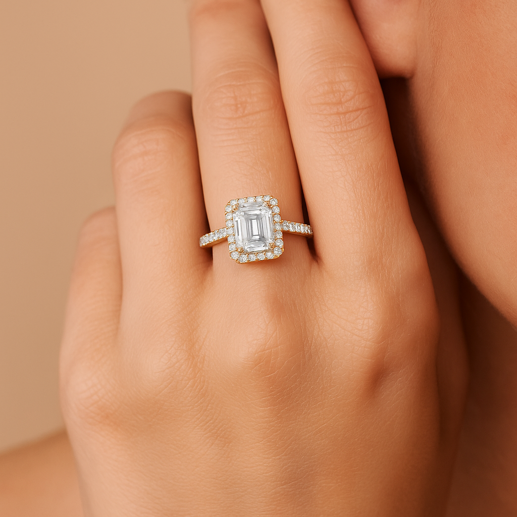 Diamond ring on a hand with a beige background