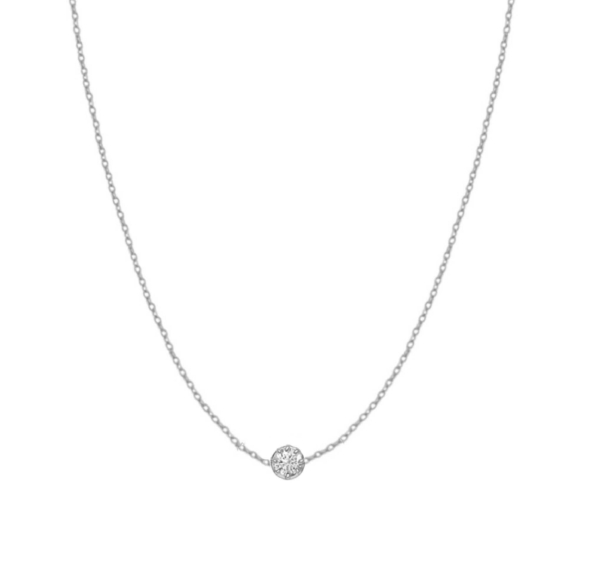 Solid gold necklace with three sparkling diamonds on a delicate chain.