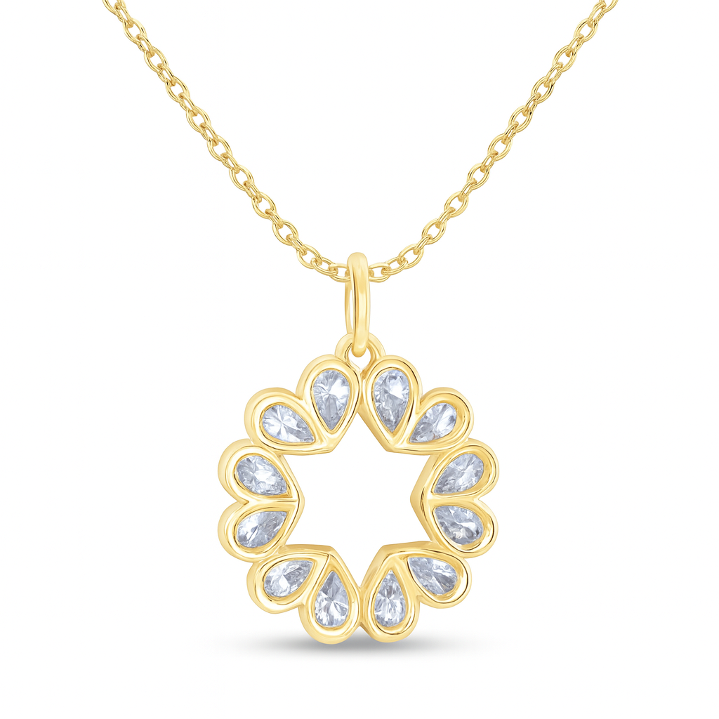 Gold necklace with a heart-shaped pendant on a white background