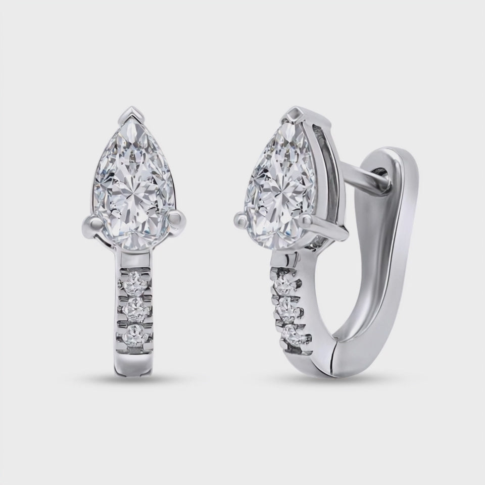 the cyrus earrings with lab grown diamonds on a white background 