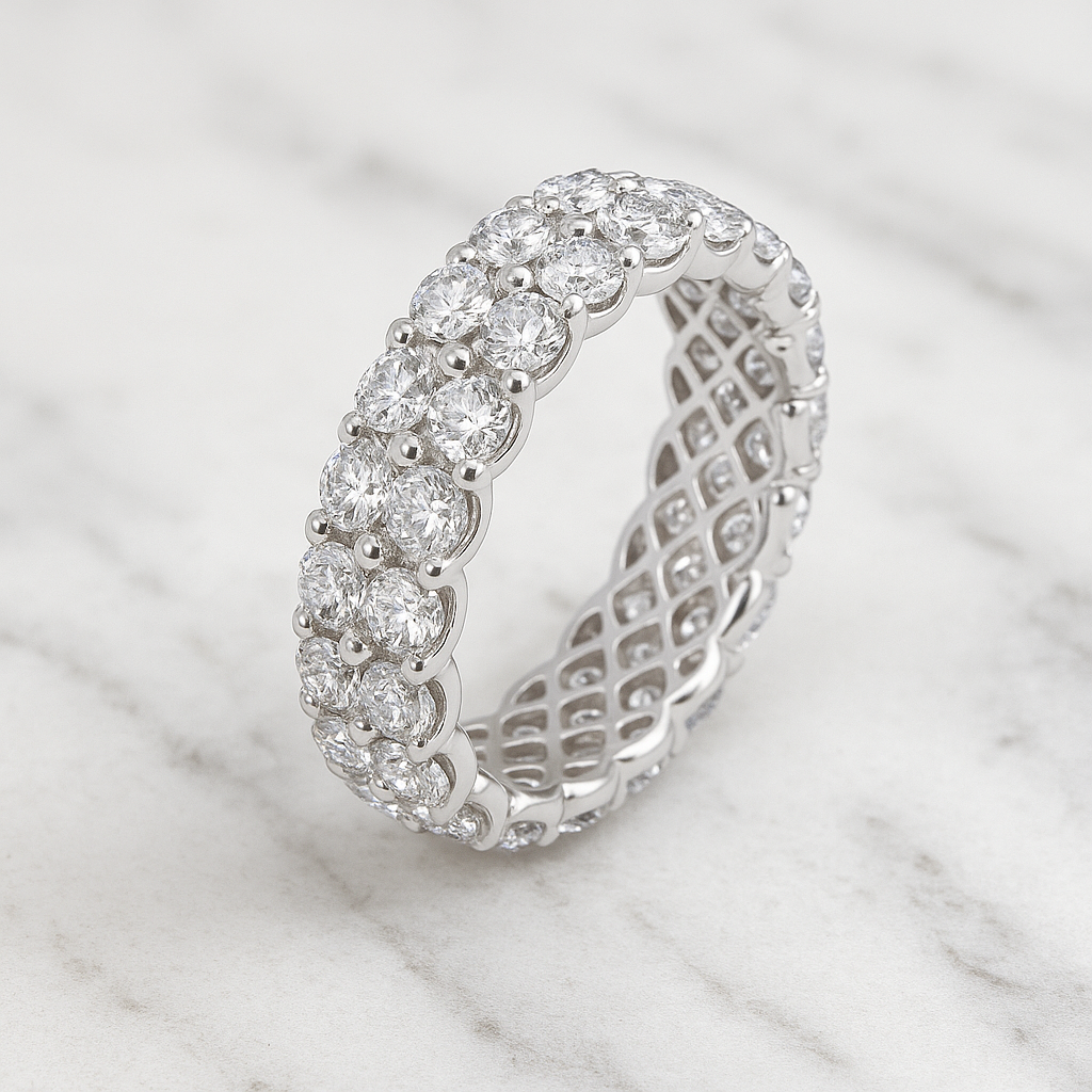 Silver ring with diamond accents on a marble background