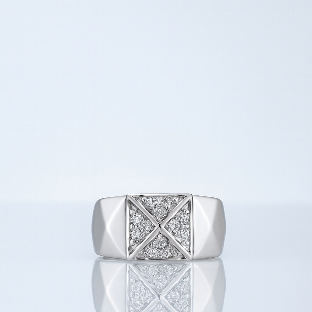 Silver ring with geometric design on a light gray background