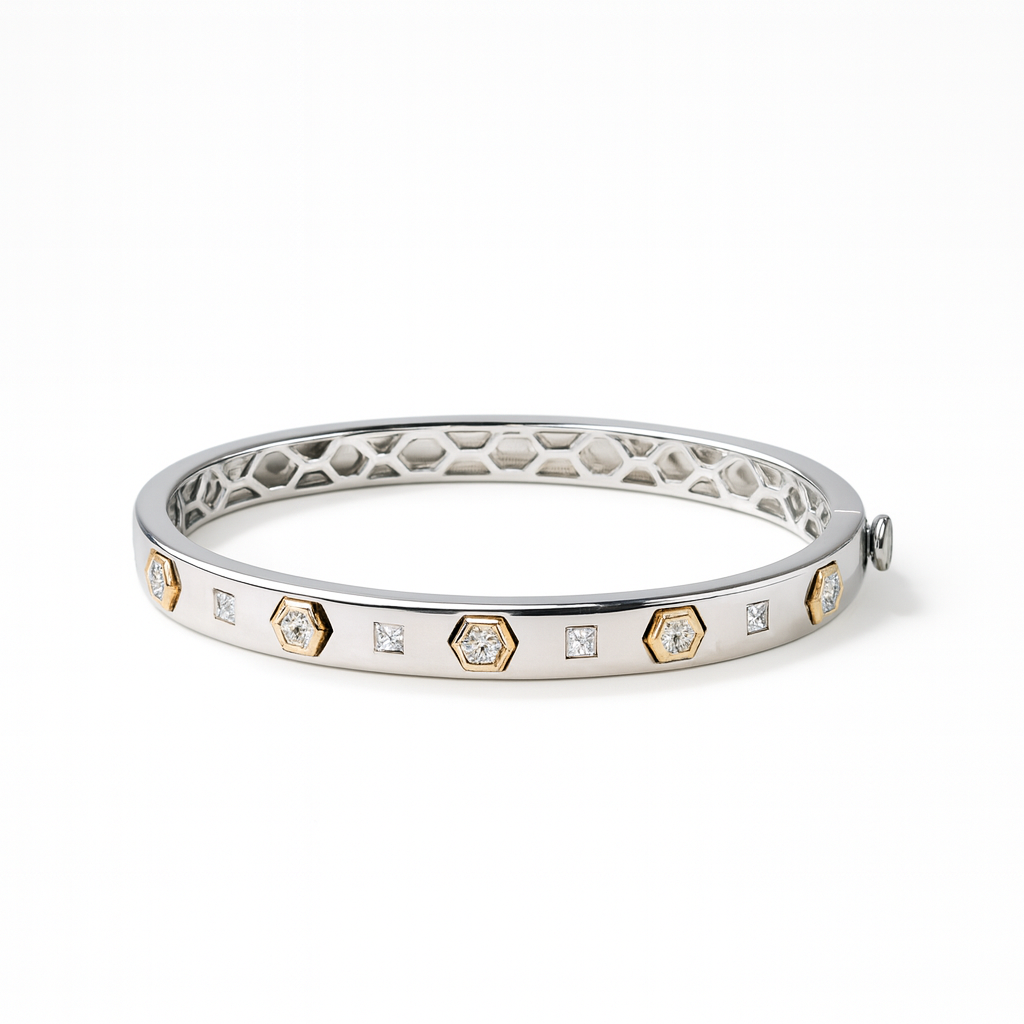 Silver bracelet with diamond accents on a white background