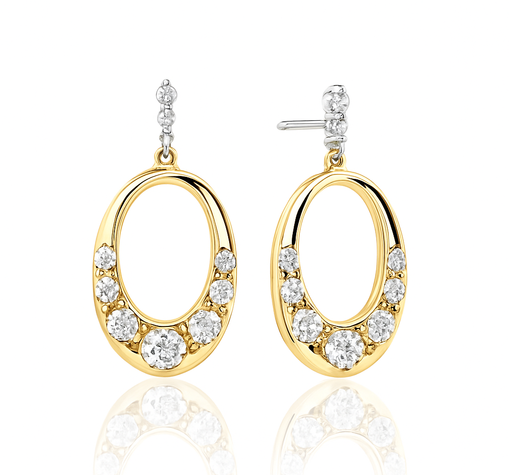 Gold hoop earrings with clear gemstones on a white background