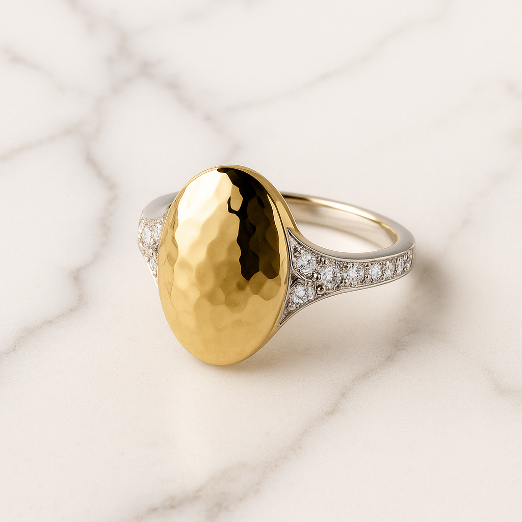 Gold ring with a textured surface on a marble background