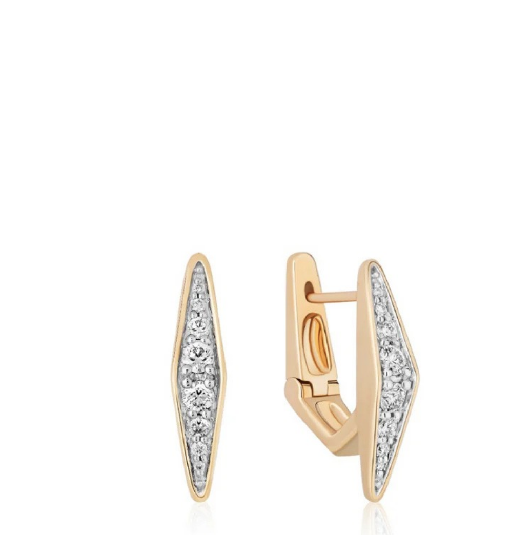 solid gold and silver earrings on a white background