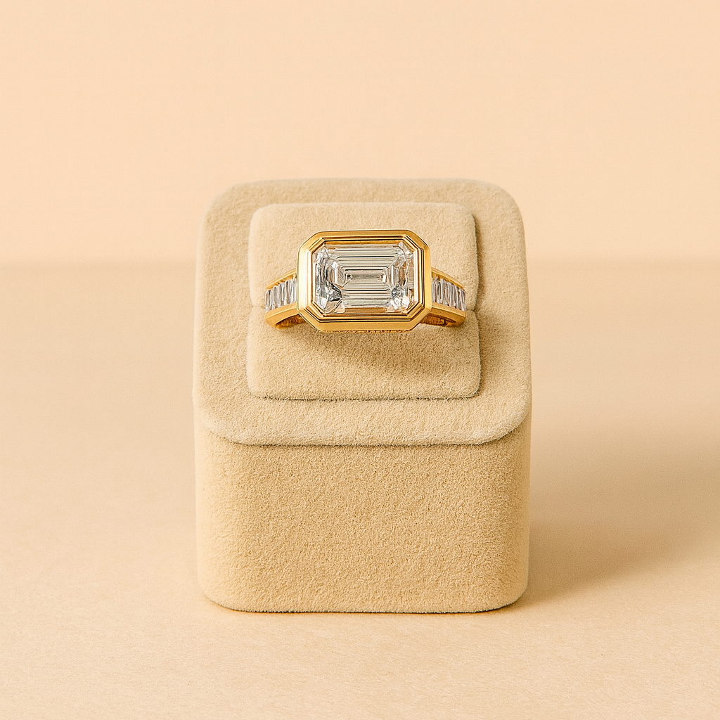 Gold ring with a large gemstone in a beige jewelry box on a beige background