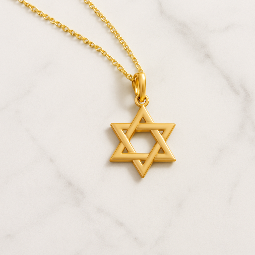 Gold Star of David necklace on a white background