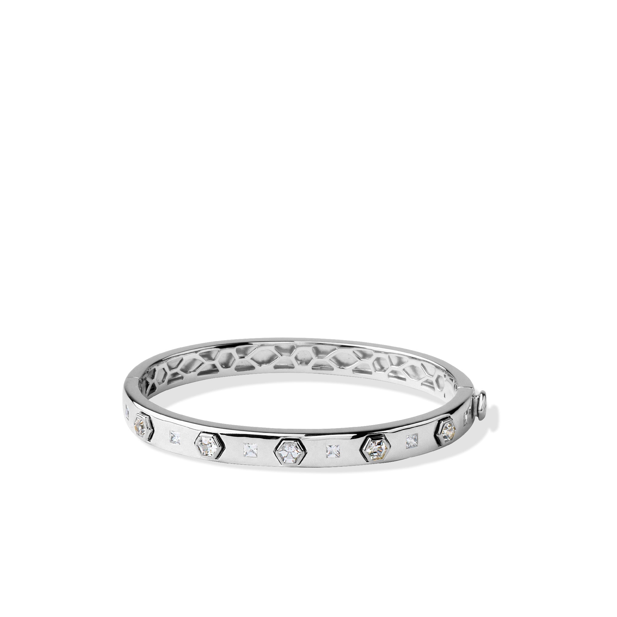 Sterling silver bangle bracelet with hexagonal and square gemstones.